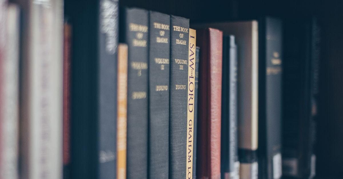 APA in text citation guide shown with books on a library shelf